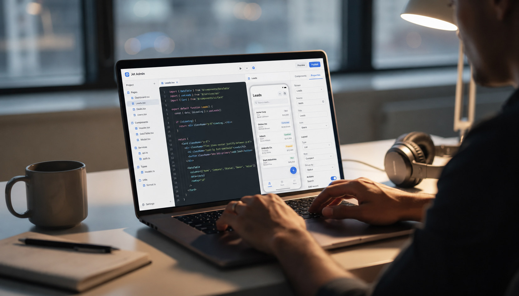 The image depicts a developer focused on a laptop, with lines of code displayed on one side and a visual interface builder on the other, illustrating the process of creating custom applications for database management. This setup highlights the integration capabilities of platforms like FileMaker Pro, emphasizing a user-friendly approach to app development and data management.