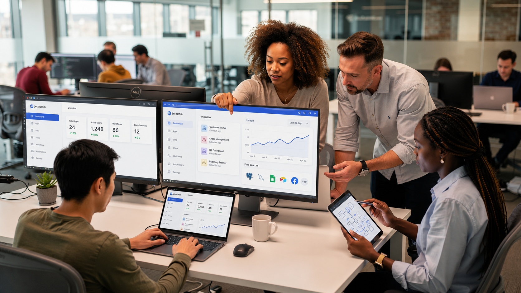 The image depicts a diverse team of developers and business analysts collaborating around large monitors that display application interfaces, emphasizing the use of low code development platforms for rapid application development. The scene highlights teamwork in creating custom applications, showcasing a blend of technical expertise and business insight in a modern visual development environment.